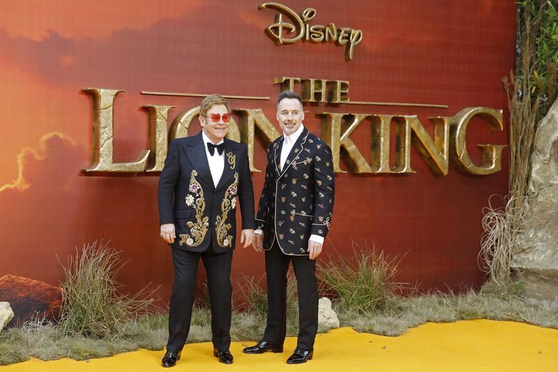 Elton John and David Furnish attend the premiere of Disney's 'The Lion King' in London's Leicester Square on July 14, 2019. AFP