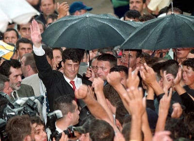 epa08507306 (FILE) Political leader of the Kosovo Liberation Army (KLA), Hashim Tachi 
(C left) waves to a cheering crowd in the refugees camp Stenkovec on Wednesday 16 June 1999 (reissued 24 June 2020). According to reports, The Specialist Prosecutor's Office (SPO) filed a ten-count Indictment with the Kosovo Specialist Chambers (KSC) for the Court's consideration, charging Hashim Thaci, with a range of crimes against humanity and war crimes, including murder, enforced disappearance of persons, persecution, and torture. The Indictment is only an accusation. It is the result of a lengthy investigation and reflects the SPO's determination that it can prove all of the charges beyond a reasonable doubt.  EPA/GEORGI LICOVSKI