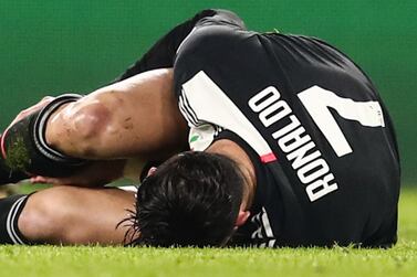 Juventus forward Cristiano Ronaldo lies on the pitch after being tackled during the UEFA Champions League match against Atletico Madrid. AFP