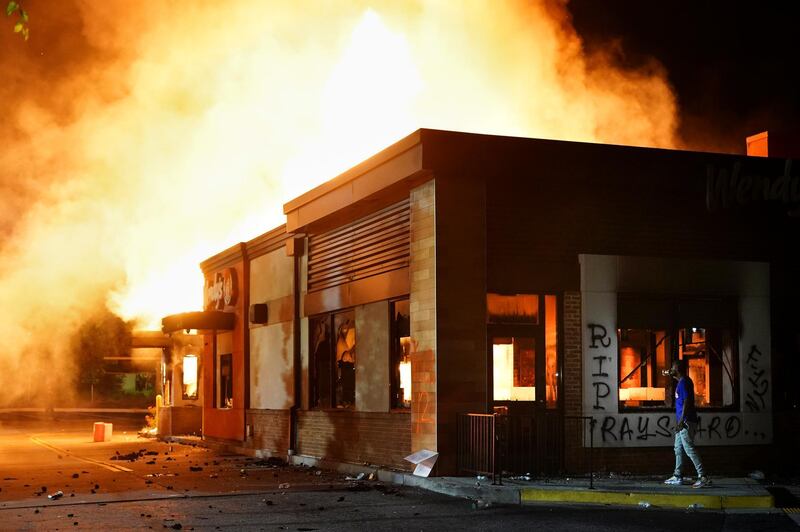 A Wendy’s burns following a rally against racial inequality and the police shooting death of Rayshard Brooks, in Atlanta, Georgia. Reuters