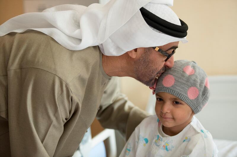 SEOUL, REPUBLIC OF KOREA (SOUTH KOREA) - February 27, 2014: HH General Sheikh Mohamed bin Zayed Al Nahyan Crown Prince of Abu Dhabi Deputy Supreme Commander of the UAE Armed Forces (L) greets Sara Al Mehrezi, 3 years old, while visiting Emirati patients at Seoul Saint Mary's Hospital in Republic of Korea. ( Mohamed Al Suwaidi / Crown Prince Court - Abu Dhabi )