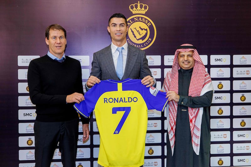 Cristiano Ronaldo, centre, alongside Rudi Garcia during his official unveiling as an Al Nassr player in January 2023. Garcia was sacked as head coach on April 13. AFP