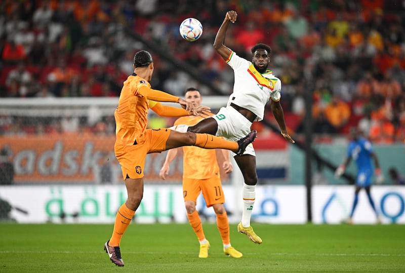 Virgil Van Dijk of the Netherlands battles for possession with Boulaye Dia of Senegal. Getty