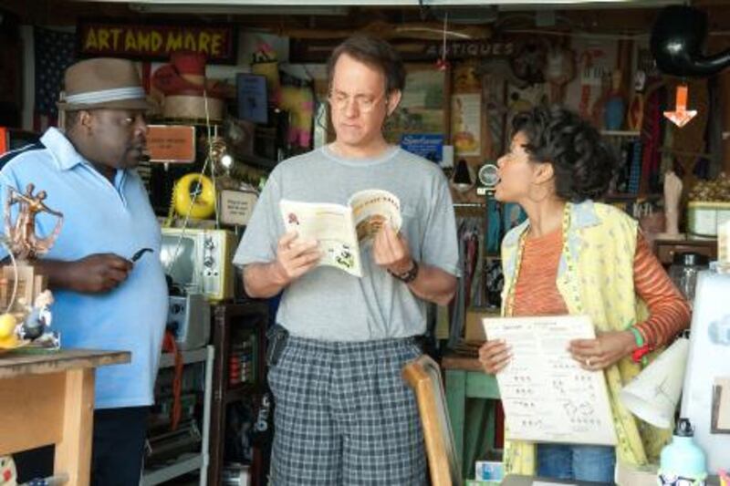 In this film publicity image released by Universal Pictures, Cedric the Entertainer, left, Tom Hanks, center, and Taraji P. Henson are shown in a scene from "Larry Crowne." (AP Photo/Universal Pictures, Bruce Talamon)