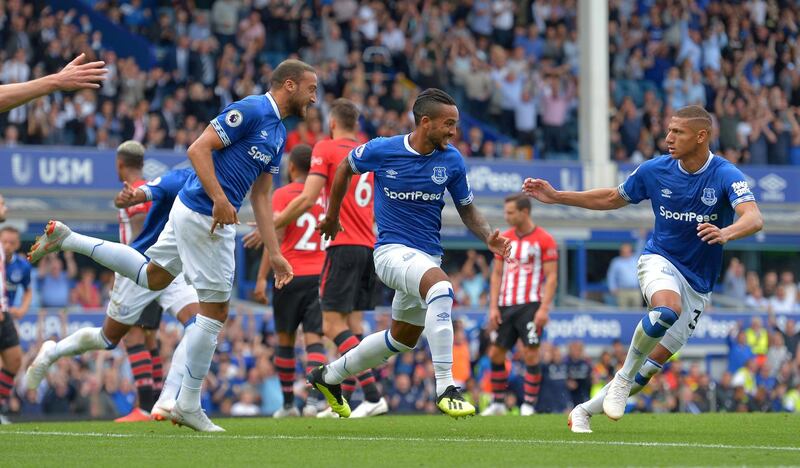 Soccer Football - Premier League - Everton v Southampton - Goodison Park, Liverpool, Britain - August 18, 2018   Everton's Theo Walcott celebrates scoring their first goal with Richarlison and Cenk Tosun   REUTERS/Peter Powell    EDITORIAL USE ONLY. No use with unauthorized audio, video, data, fixture lists, club/league logos or "live" services. Online in-match use limited to 75 images, no video emulation. No use in betting, games or single club/league/player publications.  Please contact your account representative for further details.