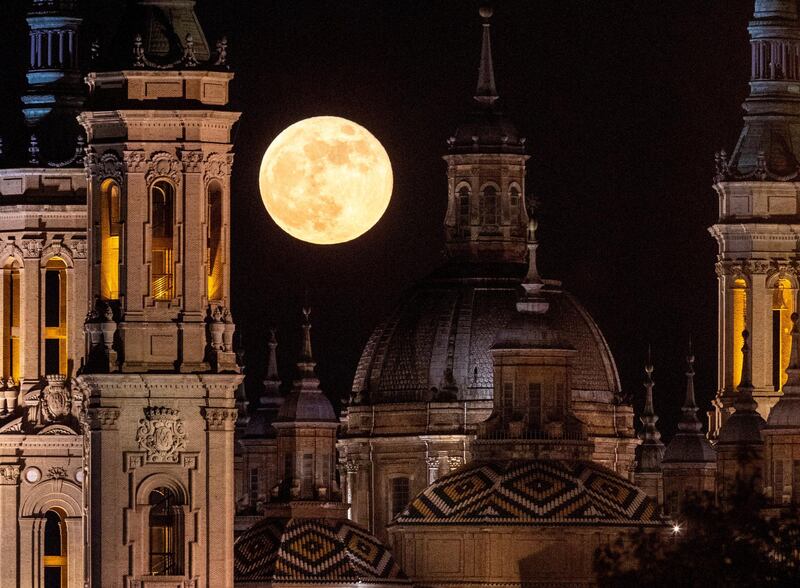 The supermoon rises above El Pilar Basilica in Zaragoza, Spain. EPA