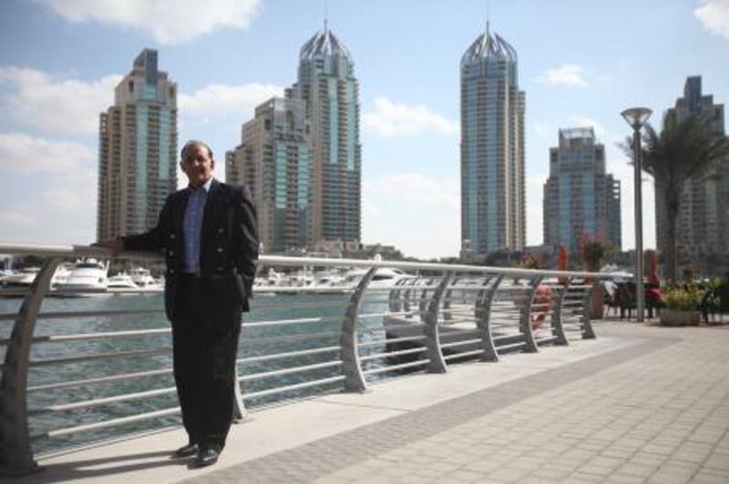 November 24, 2011, Dubaii, UAE:

Haroon Lorgat, the ICC Chief Executive, is stepping down from his post and moving back to his native South Africa (Capetown to be exact). 

He is seen here in the Dubai Marina area, exuding comfort and hapiness, clearly he won't be missing the daily stress of his job atop the cricket world.
Lee Hoagland/The National