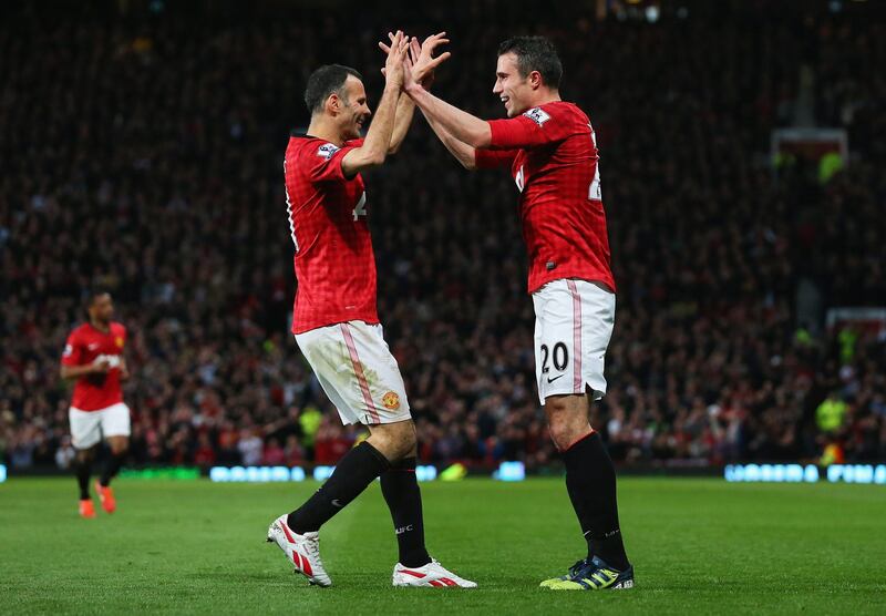 MANCHESTER, ENGLAND - APRIL 22:  Robin van Persie of Manchester United celebrates scoring his hat trick goal with Ryan Giggs during the Barclays Premier League match between Manchester United and Aston Villa at Old Trafford on April 22, 2013 in Manchester, England.  (Photo by Alex Livesey/Getty Images) *** Local Caption ***  167221668.jpg