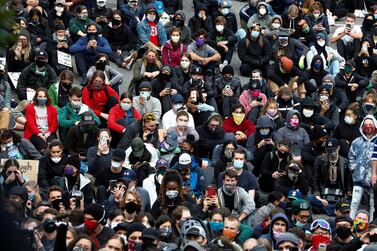 Protesters look on as Seattle Mayor Jenny Durkan addresses the crowd at the Seattle office of emergency management during a rally against police brutality and the death in Minneapolis police custody of George Floyd, in Seattle, Washington, on June 2, 2020. Reuters