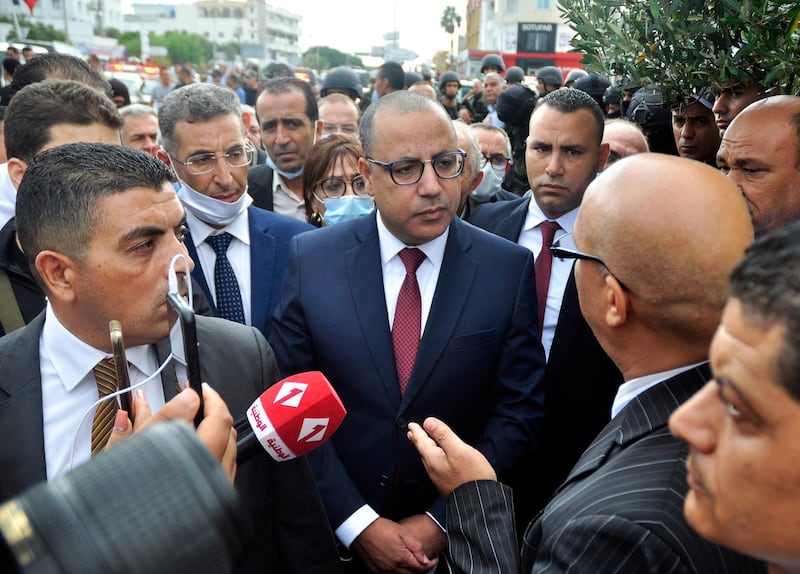 Tunisian Prime Minister Hichem Mechichi  speaks to media at  the site of an attack on Tunisian National Guard officers in Sousse, south of Tunis.  EPA
