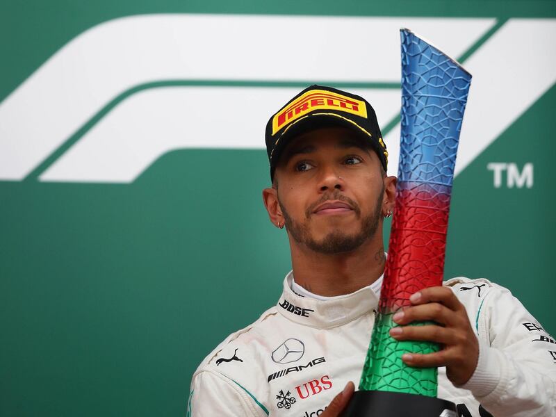 BAKU, AZERBAIJAN - APRIL 29:  Race winner Lewis Hamilton of Great Britain and Mercedes GP celebrates on the podium during the Azerbaijan Formula One Grand Prix at Baku City Circuit on April 29, 2018 in Baku, Azerbaijan.  (Photo by Clive Mason/Getty Images)