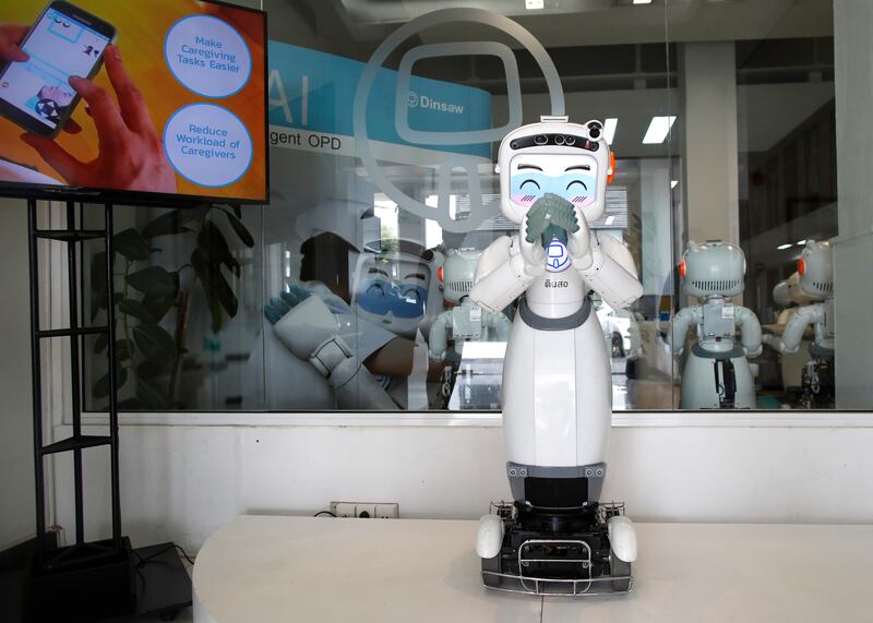 A new generation of Dinsaw robot designed for health care and service business greets people at CT Asia Robotics in Bangkok. Large language models are type of generative AI that can imitate human intelligence. EPA