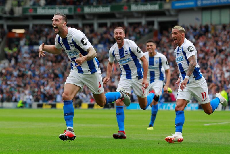 Brighton's Shane Duffy, left, celebrates scoring the second goal with teammates. Reuters