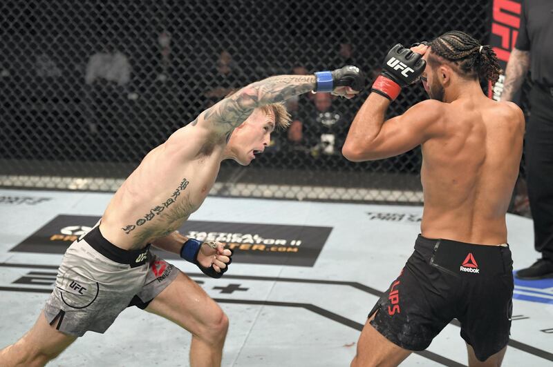 ABU DHABI, UNITED ARAB EMIRATES - OCTOBER 04:  (L-R) Cameron Else of England punches Kyler Phillips in their bantamweight bout during the UFC Fight Night event inside Flash Forum on UFC Fight Island on October 04, 2020 in Abu Dhabi, United Arab Emirates. (Photo by Josh Hedges/Zuffa LLC) *** Local Caption *** ABU DHABI, UNITED ARAB EMIRATES - OCTOBER 04:  (L-R) Cameron Else of England punches Kyler Phillips in their bantamweight bout during the UFC Fight Night event inside Flash Forum on UFC Fight Island on October 04, 2020 in Abu Dhabi, United Arab Emirates. (Photo by Josh Hedges/Zuffa LLC)