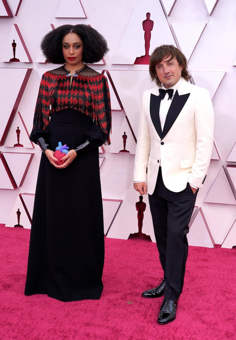 Celeste Waite, left, and Daniel Pemberton arrive at the 93rd Academy Awards at Union Station in Los Angeles, California, on April 25, 2021. AP
