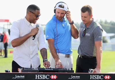 From left: DJ Reggie Yates, Dustin Johnson and Henrik Stenson. The players competing at the Abu Dhabi HSBC Championship will approach the first tee at the National Course accompanied by music. Courtesy Four Communications