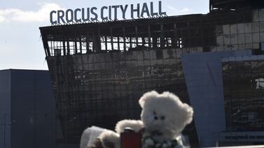 Flowers and toys are seen left outside the burnt-out Crocus City Hall concert venue outside Moscow this week. AFP