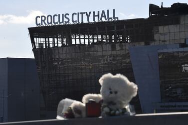 Flowers and toys are seen left outside the burnt-out Crocus City Hall concert venue outside Moscow this week. AFP