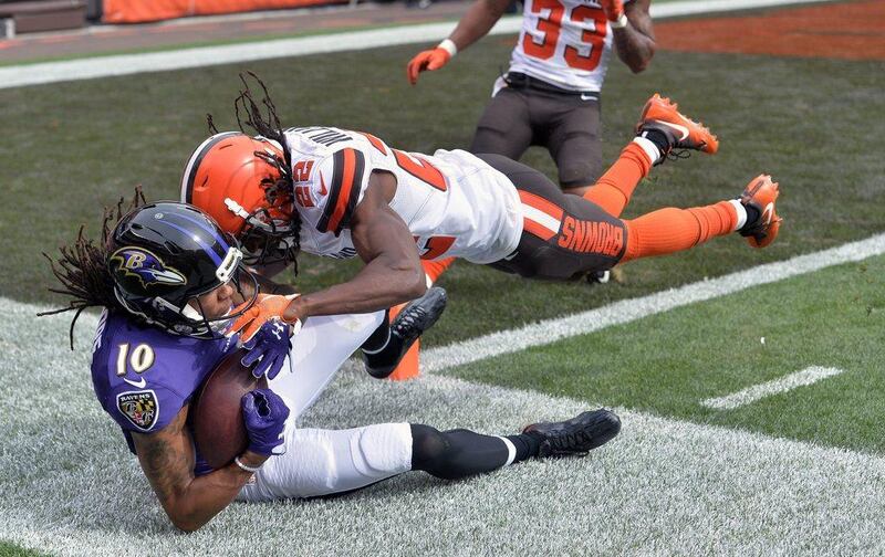 Baltimore Ravens 25 Cleveland Browns 20: Ravens wide receiver Chris Moore is tackled out of bounds by Browns cornerback Tramon Williams. David Richard / AP Photo