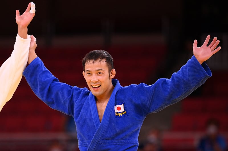 Japan's Naohisa Takato celebrates winning the judo men's 60kg final bout against Taiwan's Yang Yung Wei.