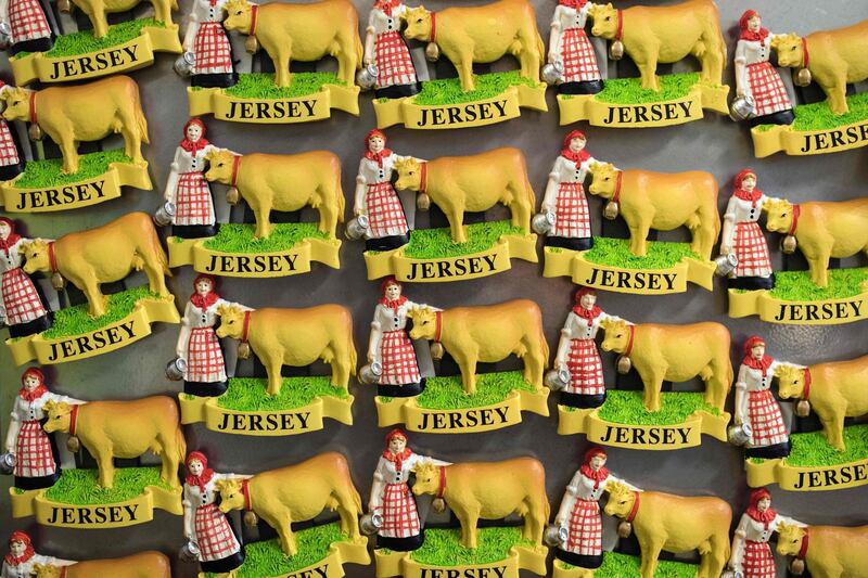 Jersey-themed fridge magnets depicting a Jersey cow are displayed for sale in St Helier, on the British island of Jersey, on November 9, 2017.
The Channel island of Jersey has come under the spotlight with the publication of the "Paradise Papers", highlighting its status as a tax destination for multinational companies. A Crown Dependency, Jersey is not part of the United Kingdom and does not have any representatives in Westminster, instead being administered by a local assembly. However, it still recognises Queen Elizabeth II as its head of state. / AFP PHOTO / OLI SCARFF