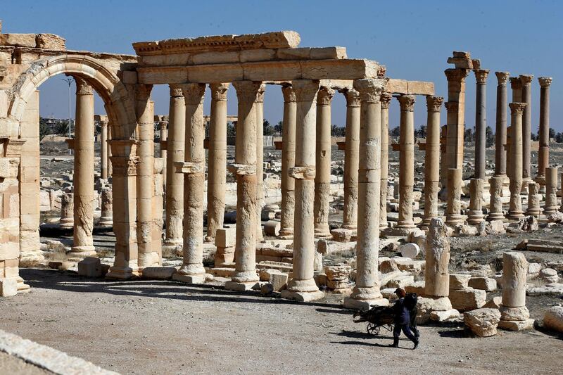 A picture shows the ruins of Syria's Roman-era ancient city of Palmyra on February 7, 2021, in the country's central province of Homs. - Syria has six sites listed on the UNESCO elite list of world heritage and all of them sustained some level of damage in the 10-year war. Besides Palmyra and Aleppo, the ancient cities of Damascus and Bosra also sustained some damage. (Photo by LOUAI BESHARA / AFP)