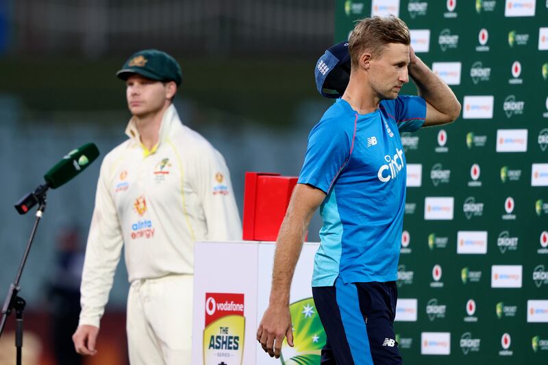 England's captain Joe Root, right, walks off as his counterpart Steve Smith takes the stage. AP