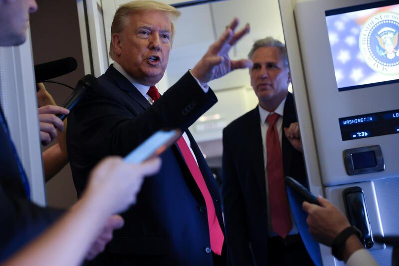 U.S. President Donald Trump, with U.S. House Minority Leader Kevin McCarthy (R-CA), speaks to reporters aboard Air Force One while returning to Washington  from Cape Canaveral, Florida, U.S. May 30, 2020. REUTERS/Jonathan Ernst