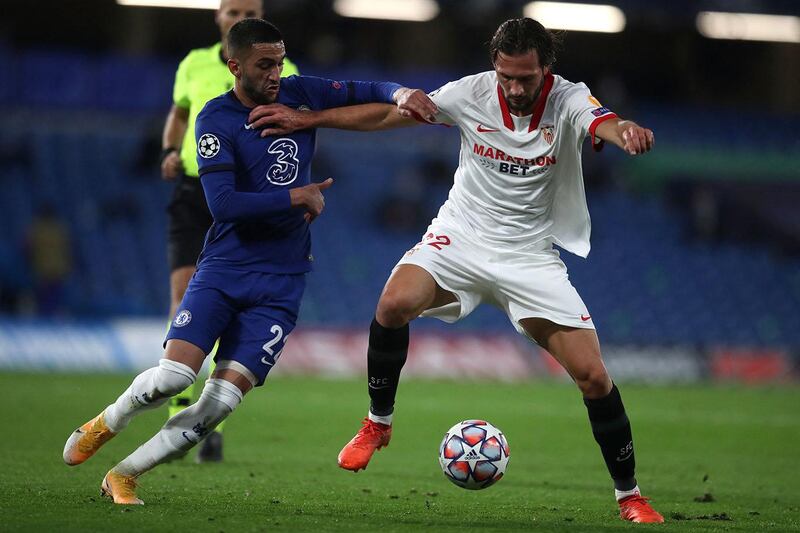 Chelsea's Moroccan midfielder Hakim Ziyech vies with Sevilla's Argentine midfielder Franco Vazquez during the UEFA Champions League first round Group E football match between Chelsea and Sevilla at Stamford Bridge in London on October 20, 2020. (Photo by Adam Davy / POOL / AFP)