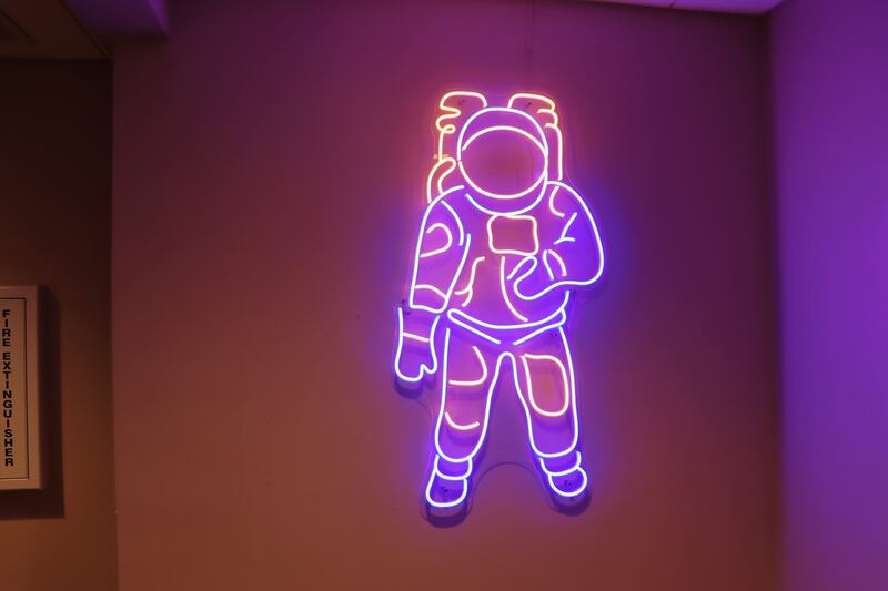 An astronaut-inspired wall art outside of the Space Bar.