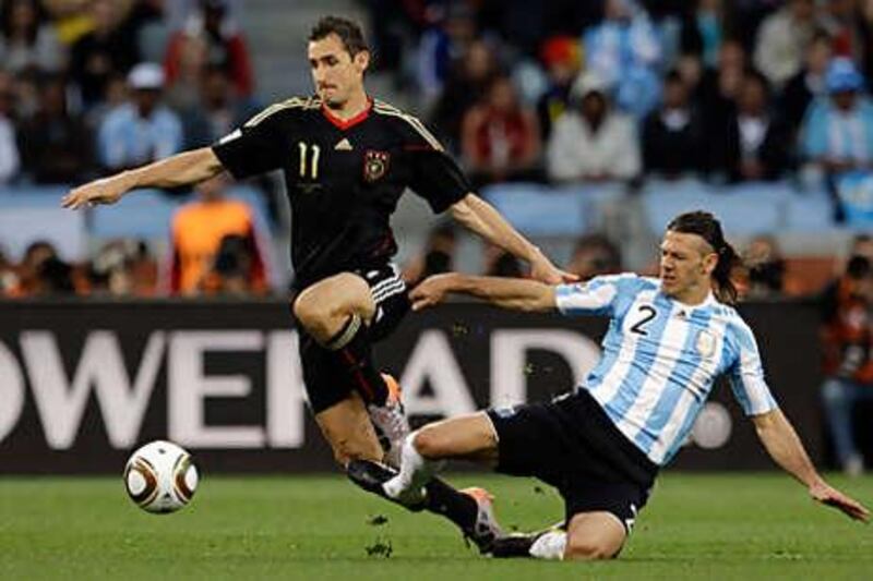 Miroslav Klose, left, scored two goals in Germany's comprehensive victory over Argentina.