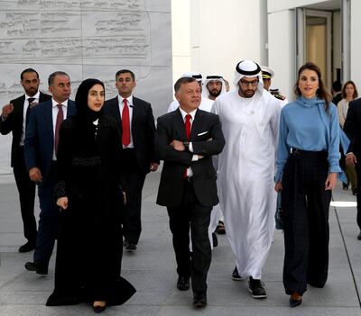 A handout picture released by the Jordanian Royal Palace on February 8, 2018 shows Jordanian King Abdullah II (C) and Queen Rania of Jordan (R) touring the Louvre Abu Dhabi Museum in the Emirati capital. / AFP PHOTO / Jordanian Royal Palace / Yousef ALLAN / RESTRICTED TO EDITORIAL USE - MANDATORY CREDIT "AFP PHOTO / JORDANIAN ROYAL PALACE / YOUSEF ALLAN" - NO MARKETING NO ADVERTISING CAMPAIGNS - DISTRIBUTED AS A SERVICE TO CLIENTS