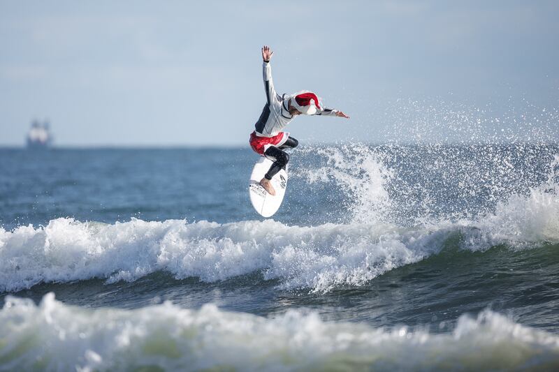 All this surfer wanted for Christmas was a tasty wave. Reuters