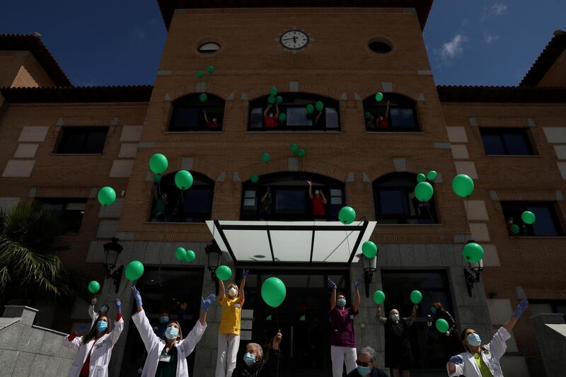 Nursing home workers and residents release balloons in the air as a tribute to the residents who passed away and to celebrate that they have remained the coronavirus disease free for over two weeks at the nursing home Centro Casaverde in Navalcarnero, outside Madrid, Spain. Reuters