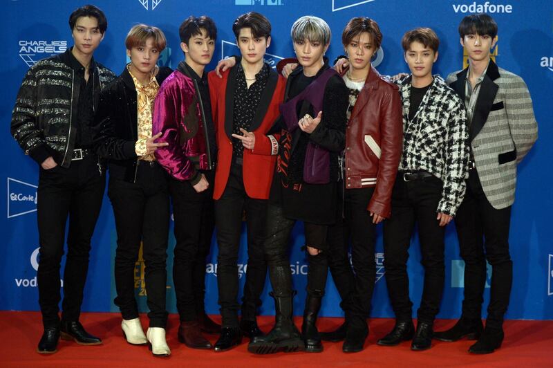 Members of the South Korean boy group NCT 127 pose for a photocall during the MTV Europe Music Awards at the FIBES Conference and Exhibition Centre of Seville on November 3, 2019. (Photo by CRISTINA QUICLER / AFP)