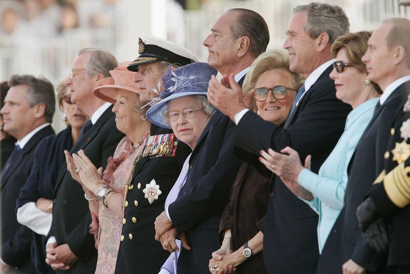ARROMANCHES, FRANCE - JUNE 6: (L_R) Queen Margrethe of Denmark, the Duke of Edinbrough, Queen Elizabeth II, French President Jacques Chirac, Bernadette Chirac, U.S President George W Bush, First Lady Laura Bush and Russian President Vladimir Putin attend the commemoration ceremony on the 60th anniversary of D-Day June 6, 2004 in Arromanches, France. (Photo by Pascal Le Segretain/Getty Images)    