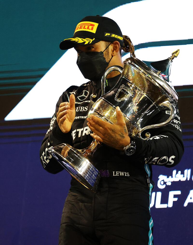 Race winner Lewis Hamilton of Mercedes celebrates on the podium at the Bahrain International Circuit. Getty