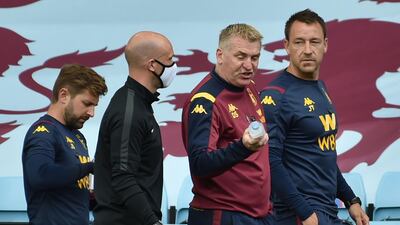 Aston Villa  coach Dean Smith (2R) and assistant  John Terry (R) after the defeat against Wolves. AFP