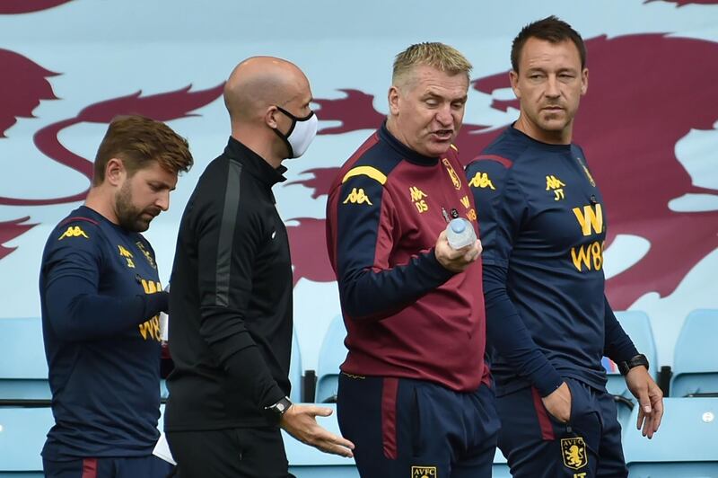 Aston Villa's English head coach Dean Smith (2R) and assistant caoch John Terry (R) discuss at the final whistle at the English Premier League football match between Aston Villa and Wolverhampton Wanderers at Villa Park in Birmingham, central England on June 27, 2020. RESTRICTED TO EDITORIAL USE. No use with unauthorized audio, video, data, fixture lists, club/league logos or 'live' services. Online in-match use limited to 120 images. An additional 40 images may be used in extra time. No video emulation. Social media in-match use limited to 120 images. An additional 40 images may be used in extra time. No use in betting publications, games or single club/league/player publications.
 / AFP / POOL / RUI VIEIRA                          / RESTRICTED TO EDITORIAL USE. No use with unauthorized audio, video, data, fixture lists, club/league logos or 'live' services. Online in-match use limited to 120 images. An additional 40 images may be used in extra time. No video emulation. Social media in-match use limited to 120 images. An additional 40 images may be used in extra time. No use in betting publications, games or single club/league/player publications.
