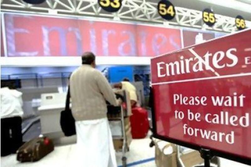 Emirates Airline says travel traffic to the UK during Ramadan is high. Above, a passenger checks in at Manchester airport. Chris Ratcliffe / Bloomberg News