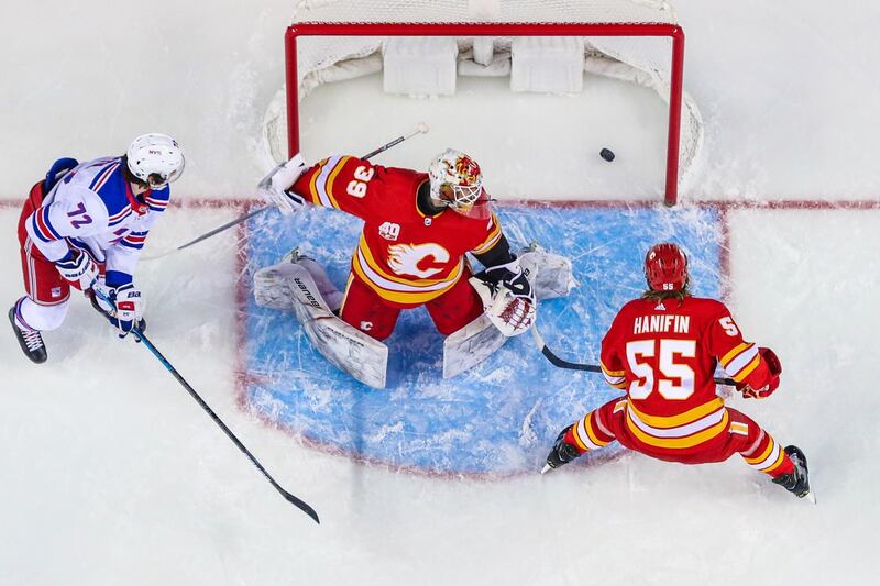 New York Rangers center Filip Chytil, left, scores against Calgary Flames in their NHL clash in Canada on Thursday, January 2. USA TODAY Sports