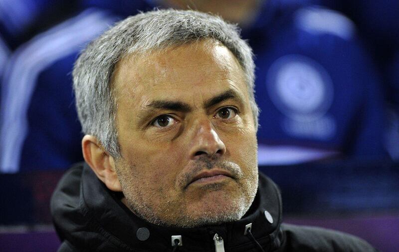 Jose Mourinho and Chelsea are two points ahead of Arsenal at the top of the Premier League. Paul Ellis / AFP 