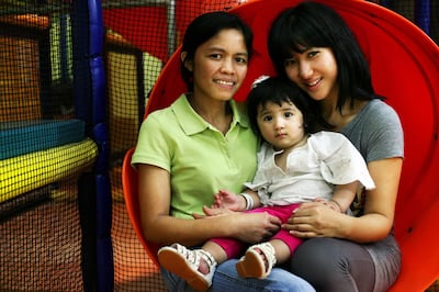 Abu Dhabi, United Arab Emirates --- September 30, 2009 --- Sarah Kim (right) has a live-in nanny, Ester Toldanes (left) for her 16 month-old daughter, Farah Kim-Naghdy. ( Delores Johnson / The National ) *** Local Caption ***  dj_30Sep09_pf_nanny_001.jpg