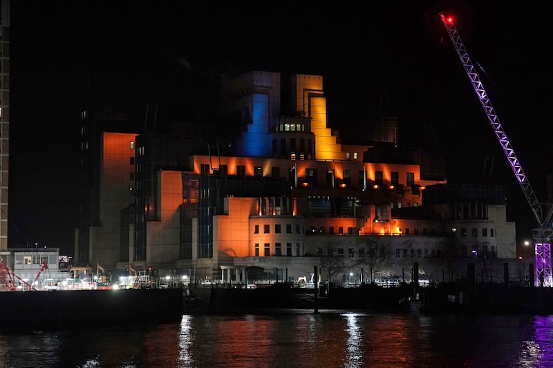 The SIS Building in central London, home to intelligence services, is lit up in an expression of solidarity with Ukraine. PA