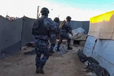 An image grab from a video made released by the YPG shows security forces conducting searches at Al Hol. AFP Photo / YPG Press Office