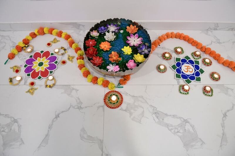 Lighting and rangoli decorations at the Grover residence. Khushnum Bhandari / The National
