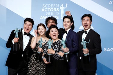 The cast of 'Parasite' poses backstage with their Outstanding Performance by a Cast in a Motion Picture award at the 2020 Sag Awards. Reuters