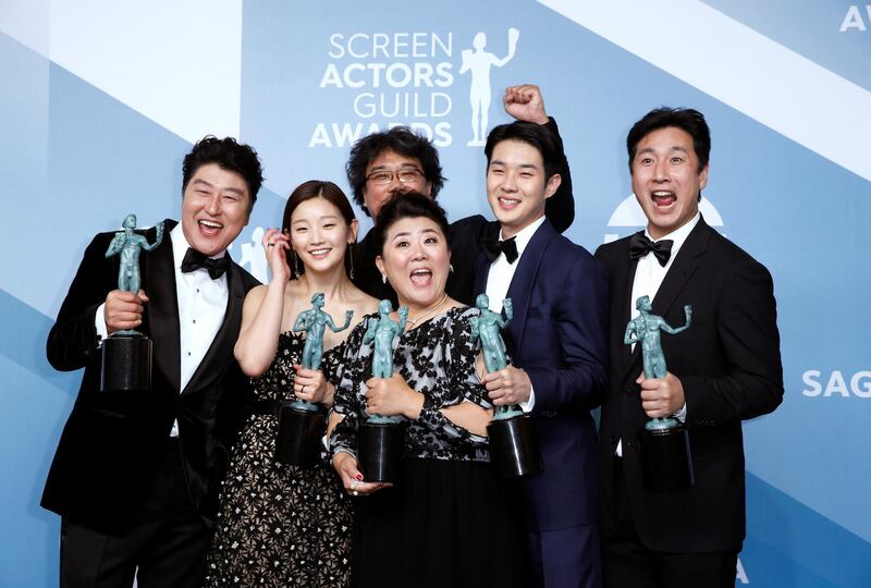 FILE PHOTO: 26th Screen Actors Guild Awards - Photo Room - Los Angeles, California, U.S., January 19, 2020 - The cast of "Parasite" poses backstage with their Outstanding Performance by a Cast in a Motion Picture award. REUTERS/Monica Almeida/File Photo