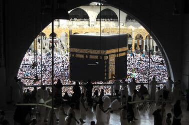 Worshippers circumambulate the Kaaba at the Grand Mosque in Makkah, which will begin receiving Umrah pilgrims again from October 4, 2020 but in far smaller numbers than seen here in May 2019. AP Photo