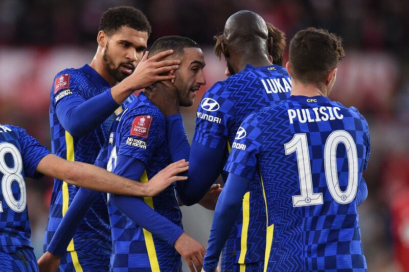 Hakim Ziyech celebrates with teammates. AFP